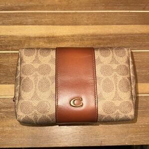 Essential Cosmetic Pouch
In Signature Canvas